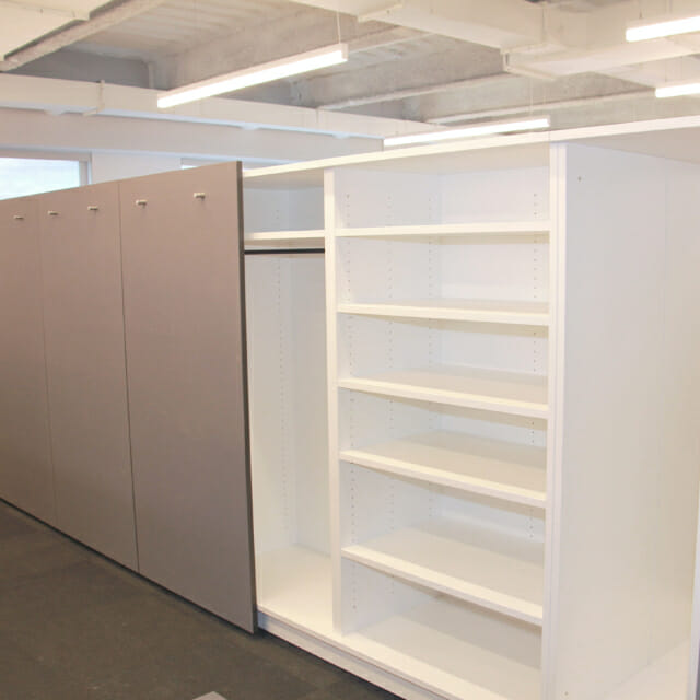 Garment and Sample Storage in Custom Island Storage Wall Garment and Sample Storage in Custom Island Storage Wall