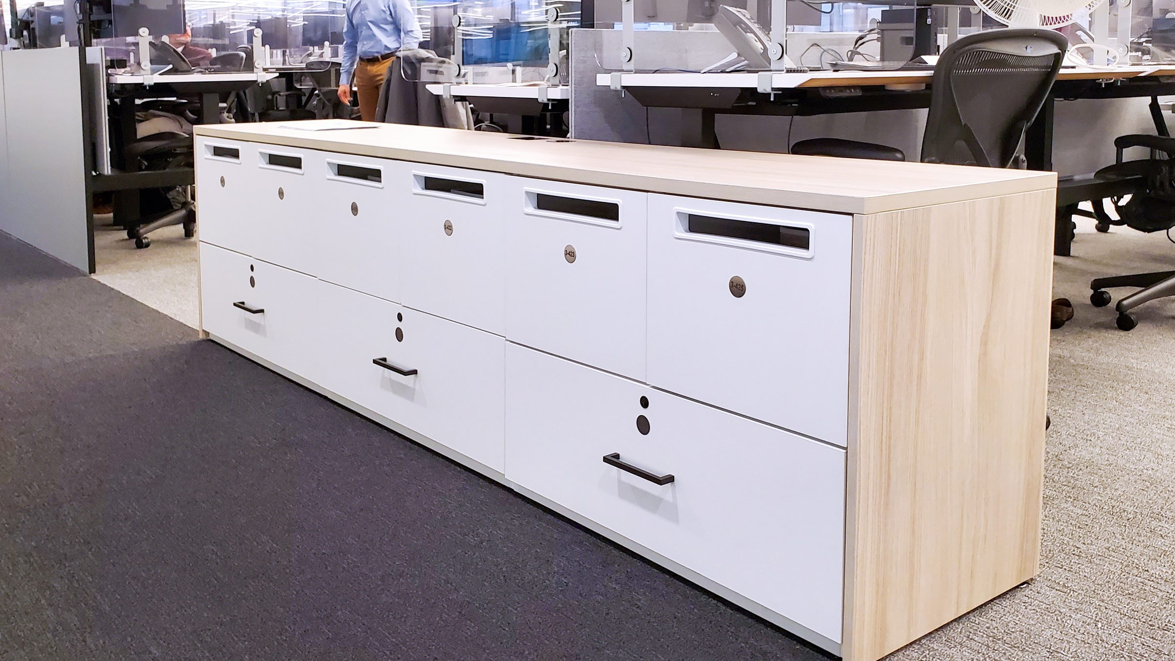 BNP Paribas counter-height locker island with maple top