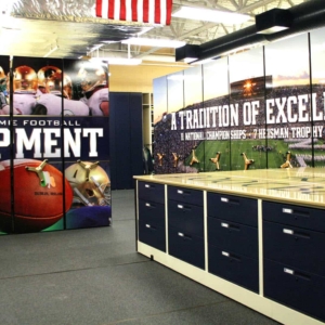 Storage in Plain Sight at Notre Dame's Football Equipment Storage Room - Custom Mobile Shelving with End-Panel and Counter-Height Worksurface