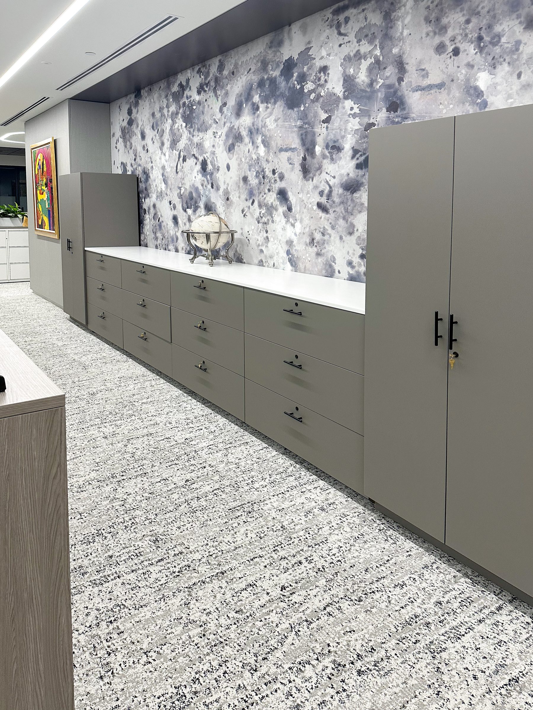 Gray custom casework with drawers — premium NYC law firm office