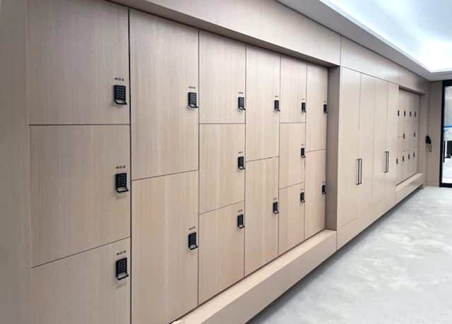 Light maple locker bank in a long built-in corridor