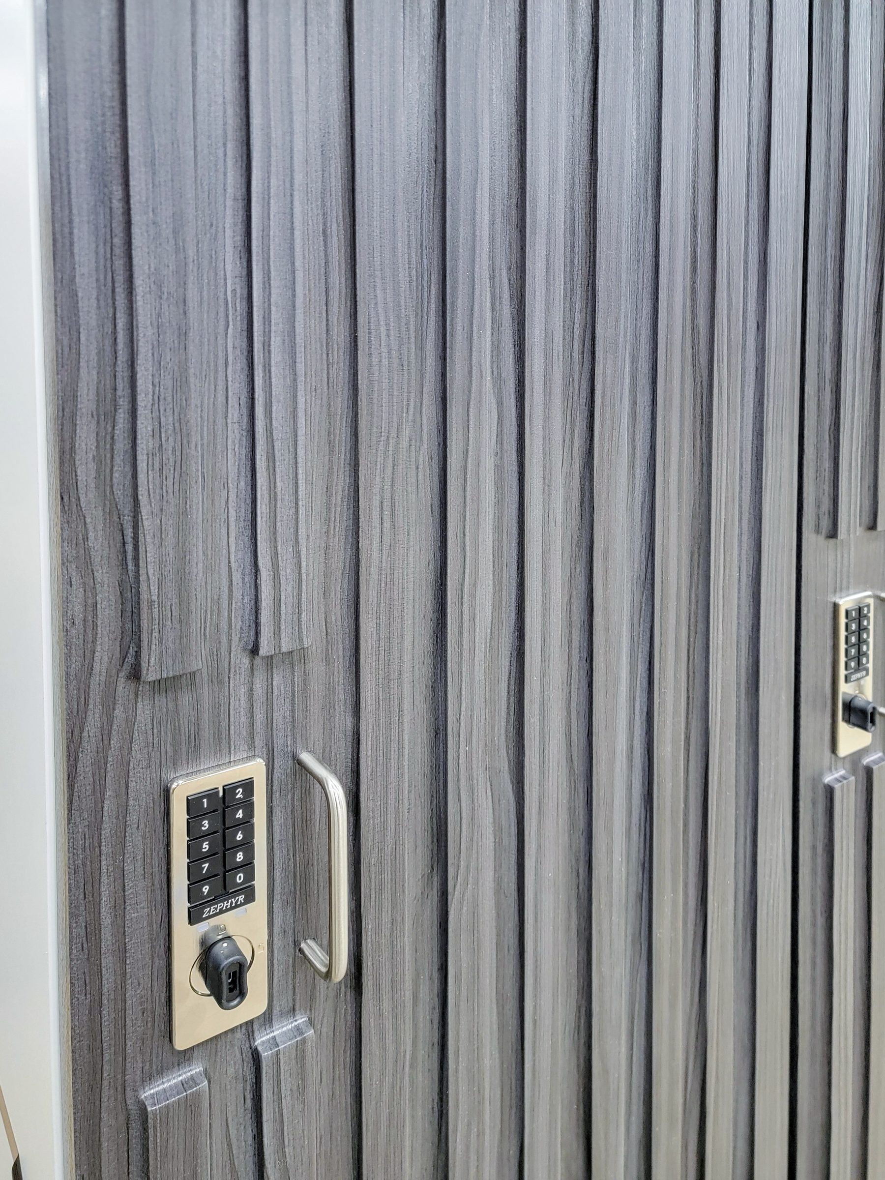 Reeded gray laminate locker door with Zephyr combination lock detail