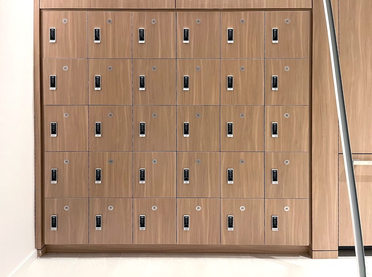 Warm woodgrain 4-tier wall lockers with digital locks — corporate office