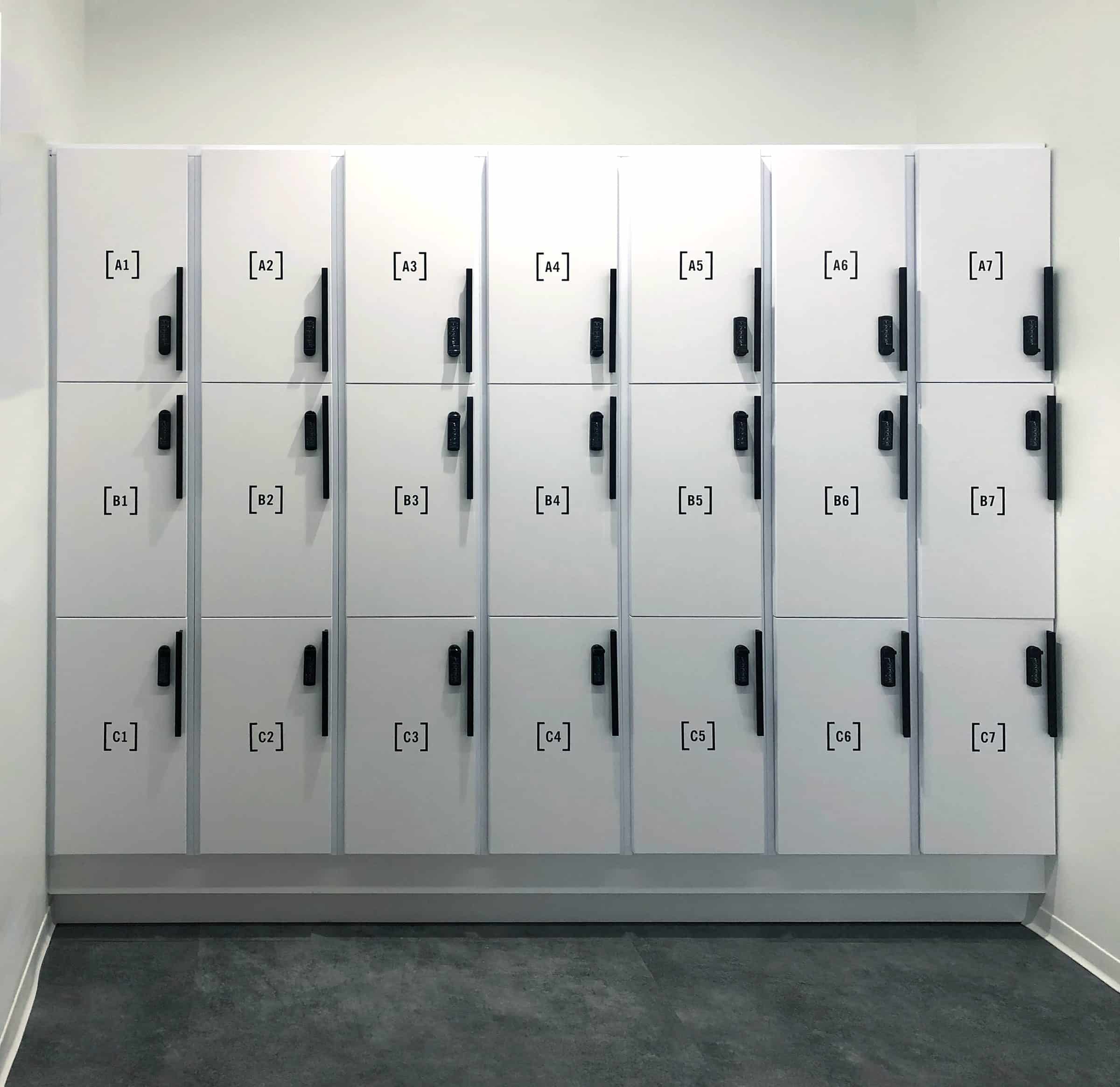 White 3-tier office locker bank with numbered labeled grid