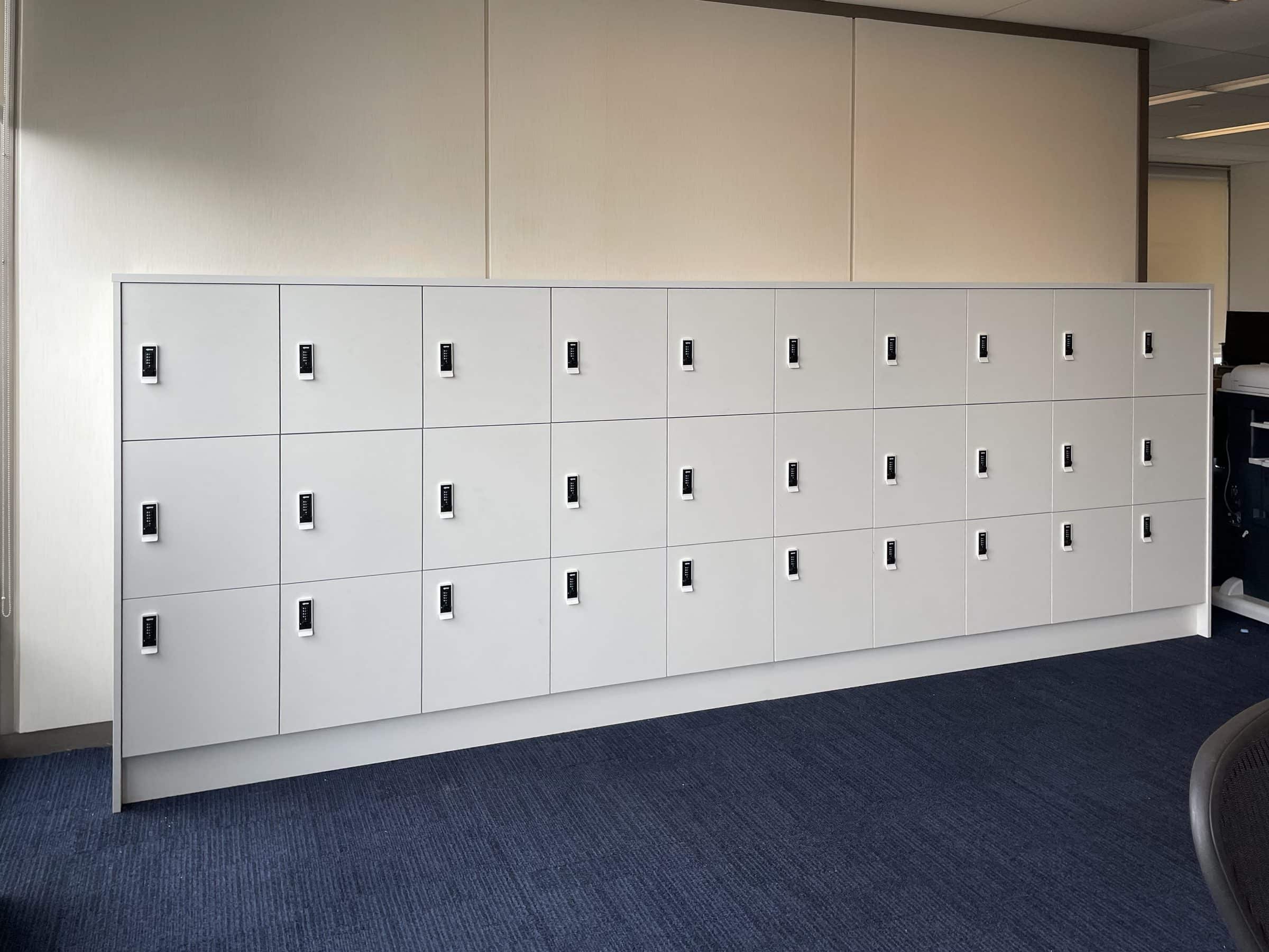 White 3-tier office locker bank in a corporate workplace
