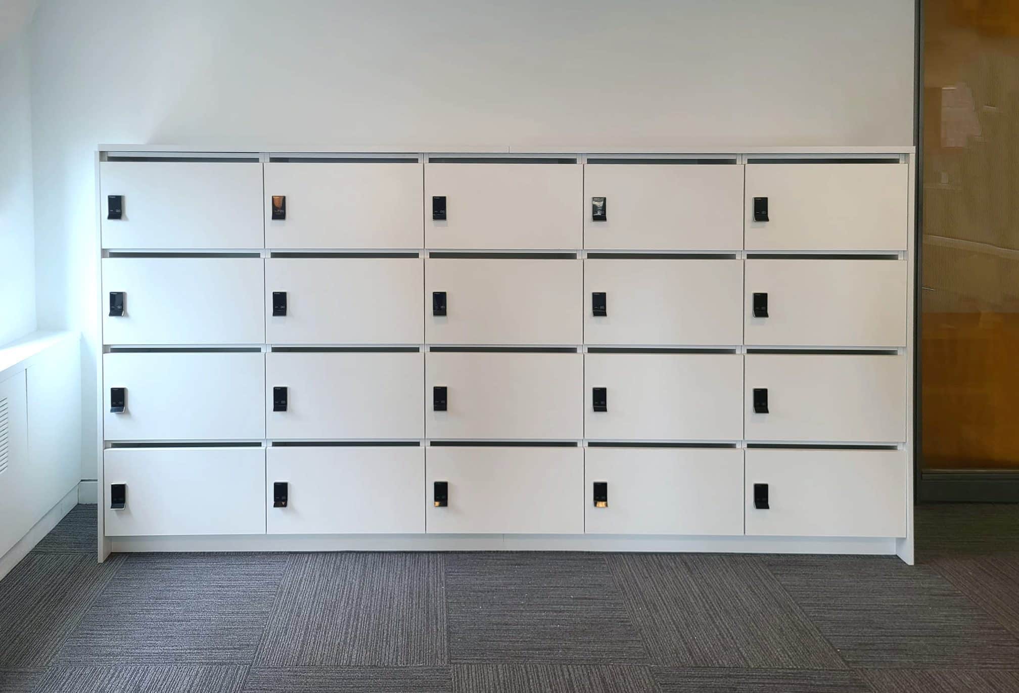 White 4-tier wall locker bank installed in a corporate NYC office