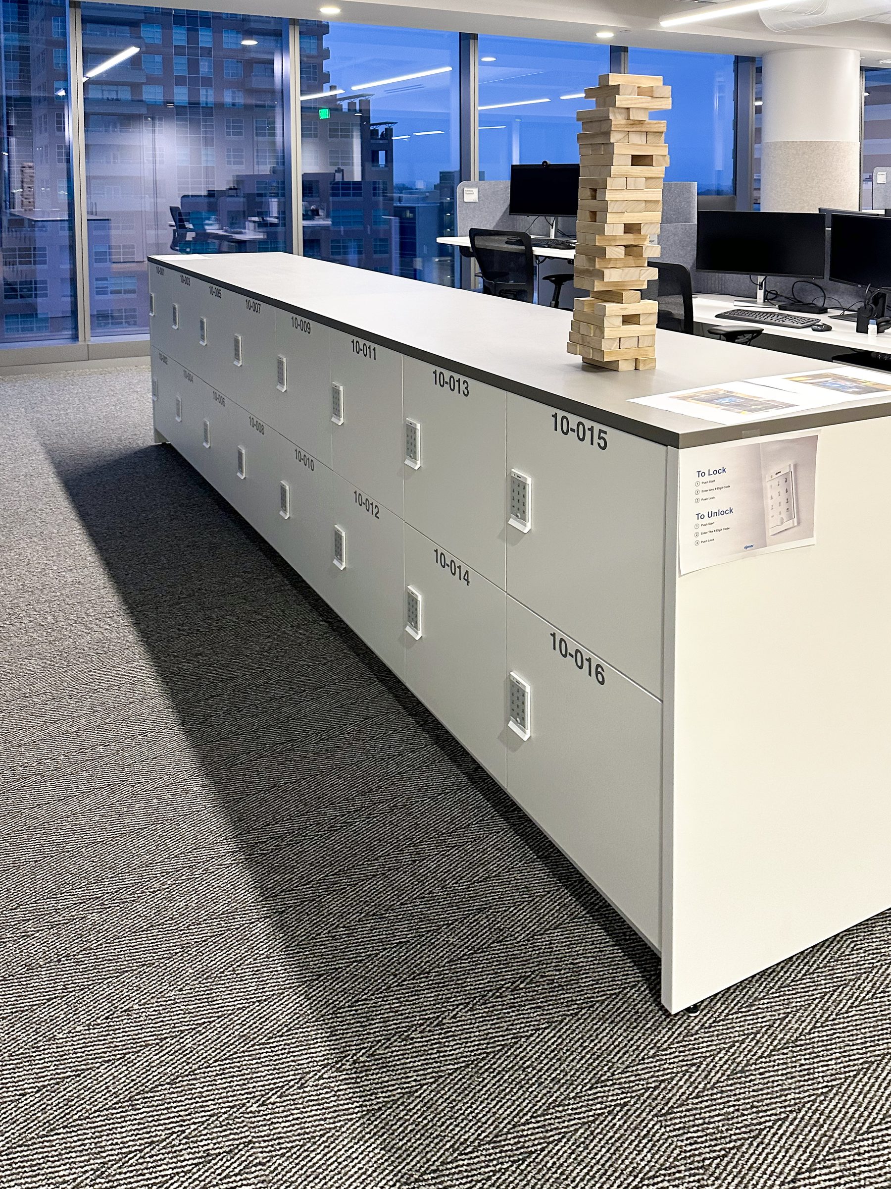 White locker end-cap island with NYC city skyline view