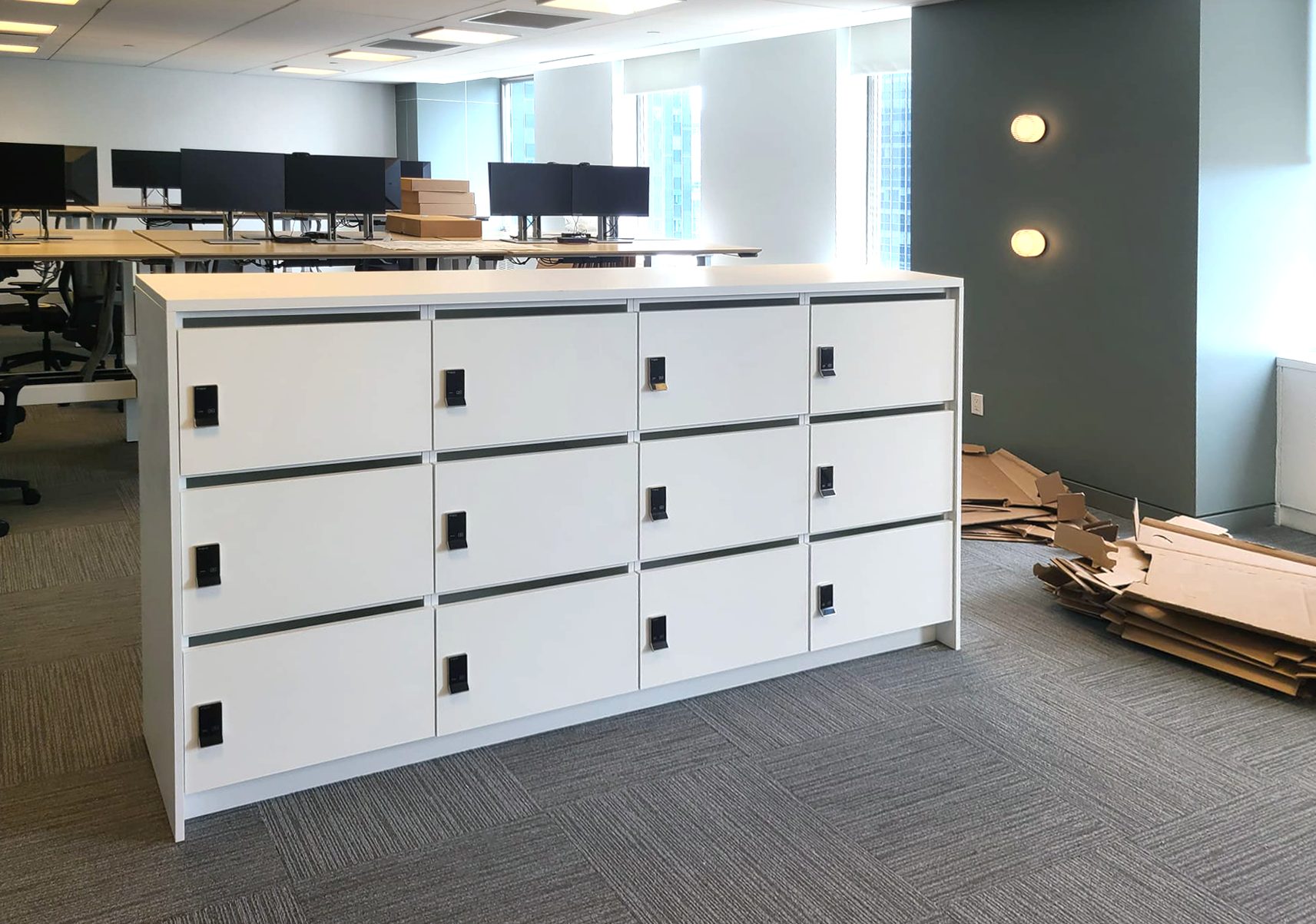 White locker island installation in open-plan office