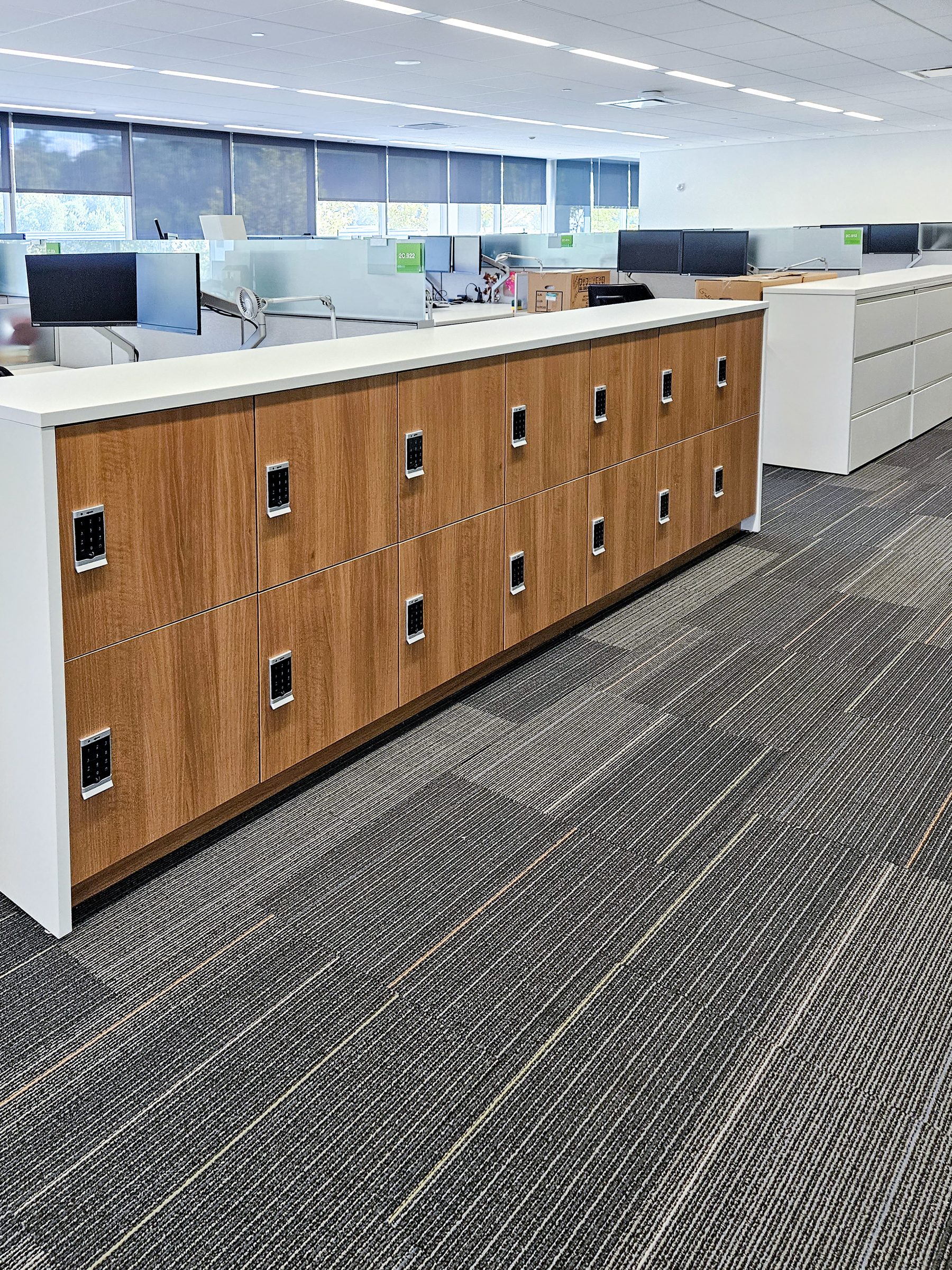 Woodgrain locker island — AbbVie corporate NYC